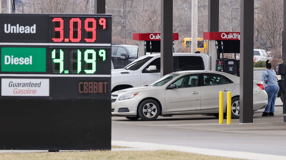 A customer waits as she pumps gas into her sedan at QuikTrip on Edwin C. Moses Boulevard in Dayton on Monday, March 2. Gas prices are expected to increase after military operations began in Iran over the weekend. BRYANT BILLING / STAFF
