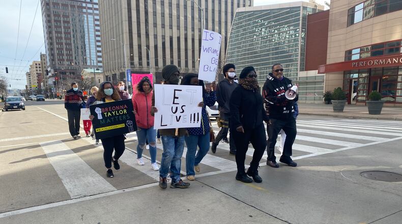 People march in the street in downtown Dayton about at a Black Lives Matter protest on the anniversary of Breonna Taylor's death in Louisville. Eileen McClory / Staff