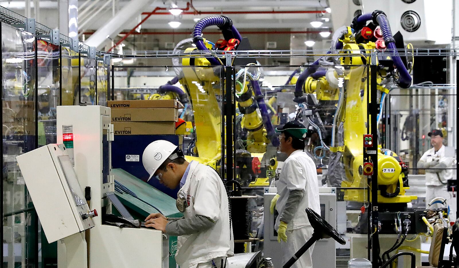 Honda workers service the robots in a welding station in the new welding facility for the 2017 Honda CRV at the East Liberty plant. Bill Lackey/Staff