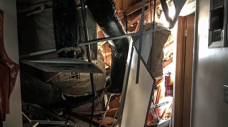 The roof in back of the Fast Fashions building on East Main Street in Xenia collapsed during heavy rain June 30, 2020. JIM NOELKER / STAFF