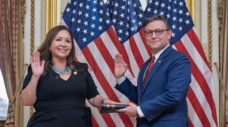 Speaker of the House Mike Johnson, R-La., holds a ceremonial swearing-in for Rep. Adelita Grijalva, D-Ariz., left, at the Capitol in Washington, Wednesday, Nov. 12, 2025. (AP Photo/J. Scott Applewhite)