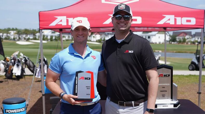 Ben Cors, left, poses with the A-10 championship trophy on Thursday, April 24, 2025, in Orlando, Fla. Photo courtesy of A-10