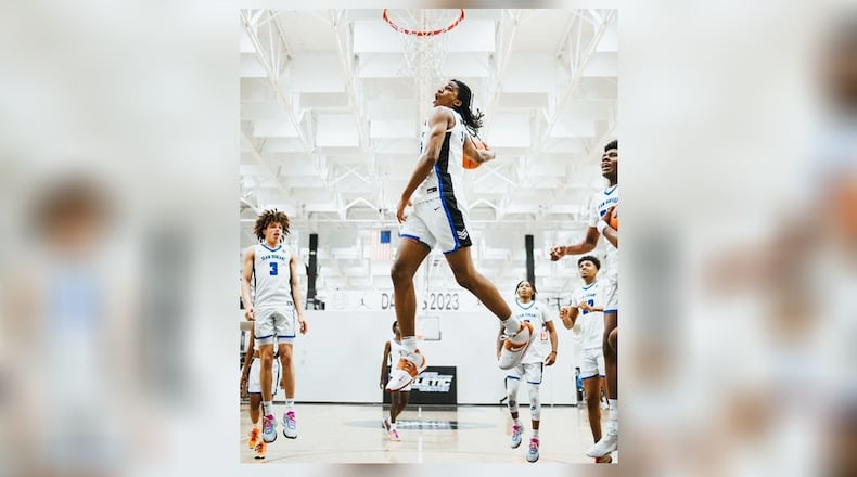 Malcolm Thomas, with his Team Durant AAU team, goes up for a one-handed monster dunk at the Peach Jam during his junior year of high school. CONTRIBUTED PHOTO