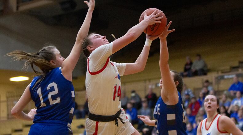 Tri-Village's Morgan Hunt splits two Danville defenders during the first half Thursday night in the Division IV regionak semifinal at Vandalia Butler. Jeff Gilbert/CONTRIBUTED