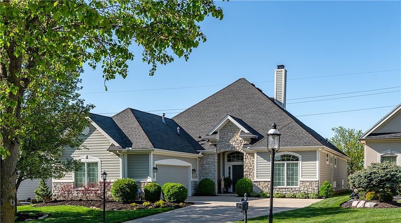 The stone and vinyl ranch style home has 2,592 square feet of finished space and three bedrooms plus a home office.