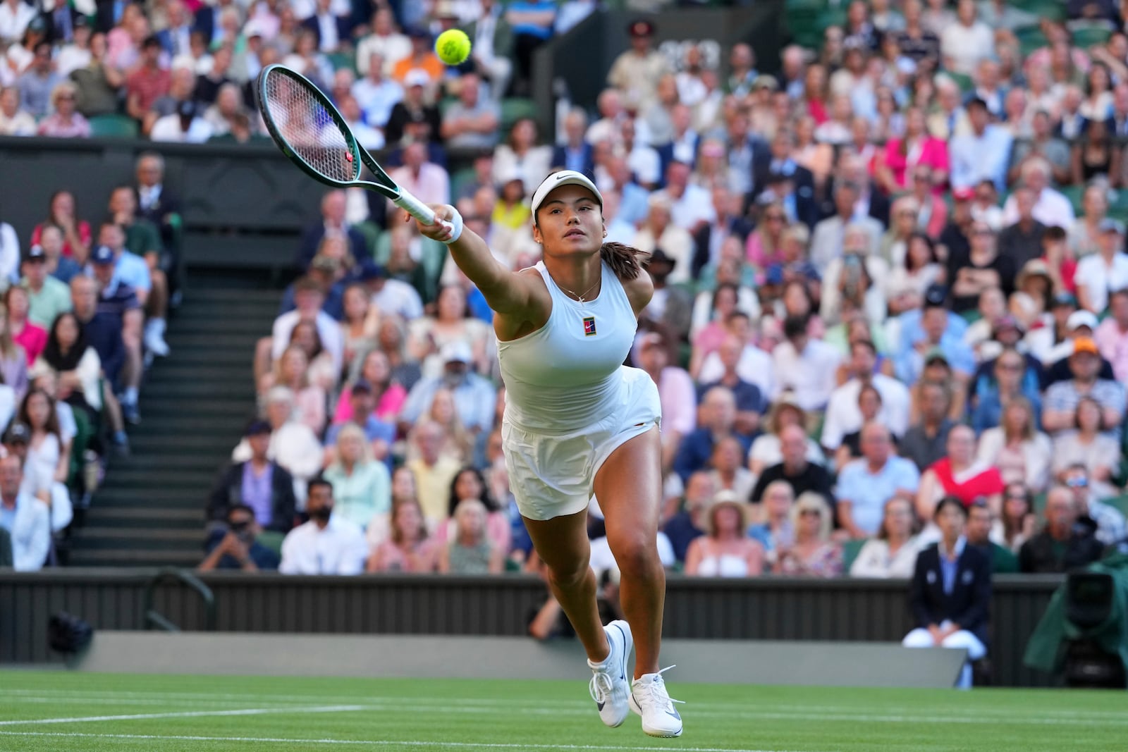 Emma Raducanu of Britain plays a return to Marketa Vondrousova of the Czech Republic during their second round women's singles match at the Wimbledon Tennis Championships in London, Wednesday, July 2, 2025.(AP Photo/Kirsty Wigglesworth)