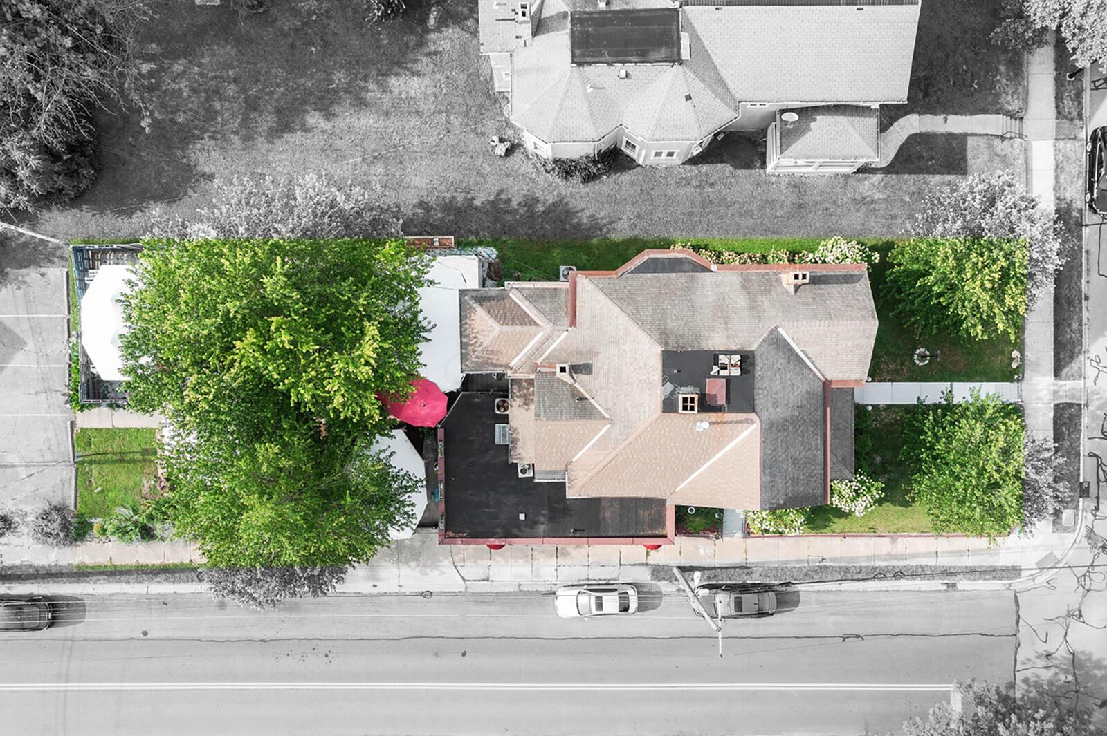 The home is zoned for multiple uses and includes an outdoor seating area for the restaurant and separate parking.