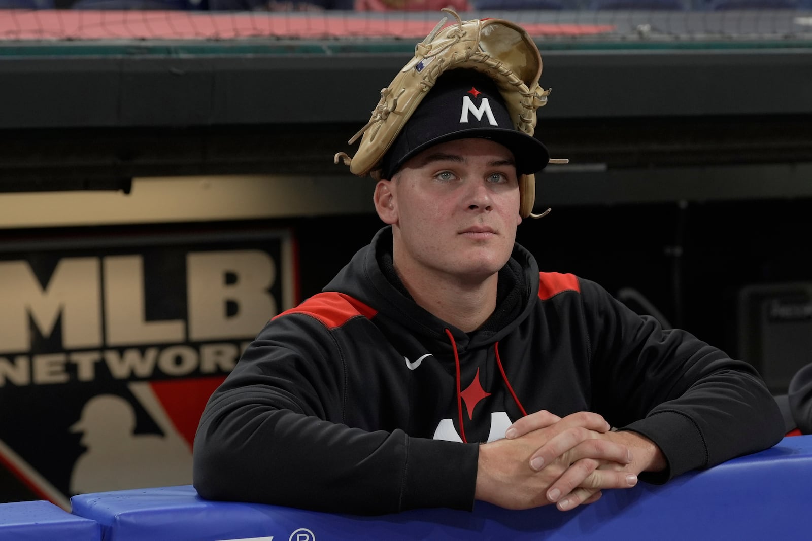 Minnesota Twins pitcher Cole Sands (44) waits in the dugout during a rain delay before a baseball game between the Twins and the Cleveland Guardians in Cleveland, Tuesday, April 29, 2025. (AP Photo/Sue Ogrocki)