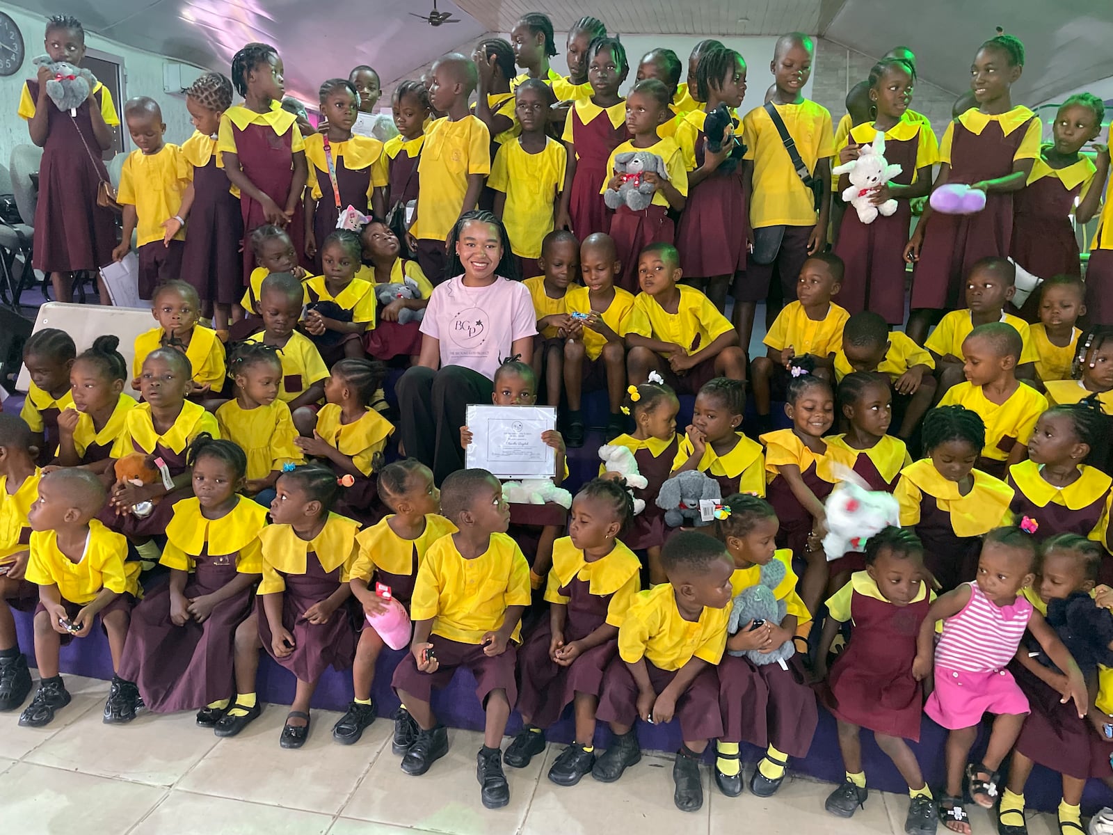 Brooke Gates (in pink) with students during a trip to Liberia. CONTRIBUTED