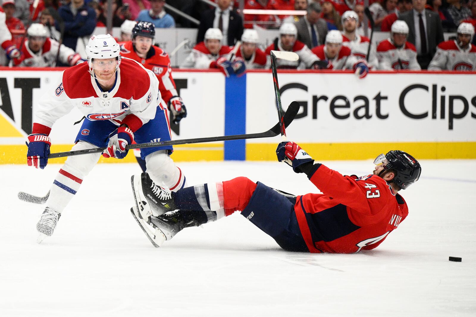 Montreal Canadiens defenseman Mike Matheson (8) battles for the puck against Washington Capitals right wing Tom Wilson (43) in the second period of Game 2 of a first-round NHL hockey playoff series Wednesday, April 23, 2025, in Washington. (AP Photo/Nick Wass)