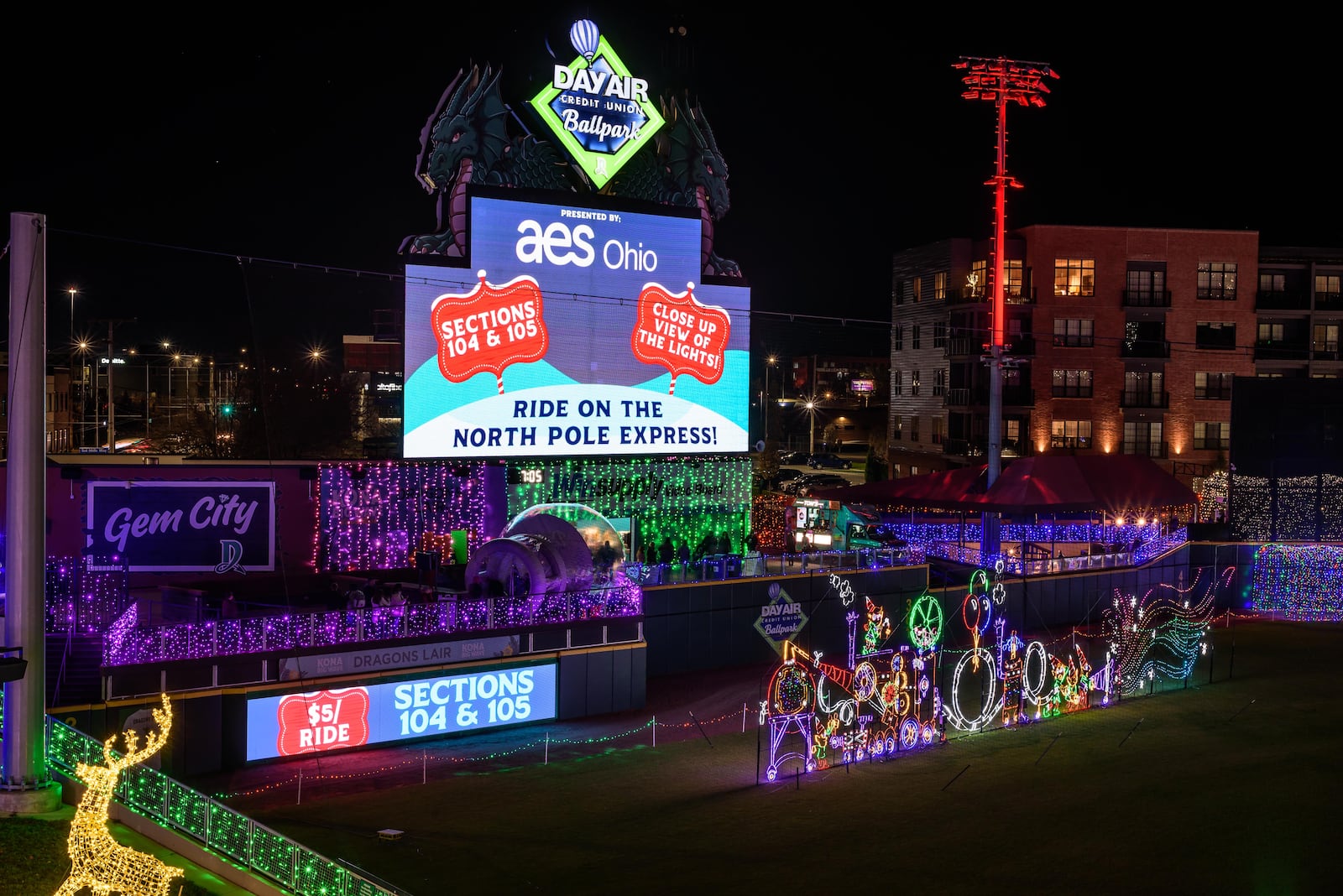 The first season of Deck the Diamond, a new Dayton holiday tradition at Day Air Ballpark, home of the Dayton Dragons, started on Nov. 14 and continues through Jan. 3, 2026. The family-friendly 45-night ticketed event features a winter wonderland of lights and decorations, tasty holiday treats and beverages, holiday shopping, the North Pole Express, a 44-foot-tall Christmas tree, photos with Santa and more. TOM GILLIAM/CONTRIBUTING PHOTOGRAPHER