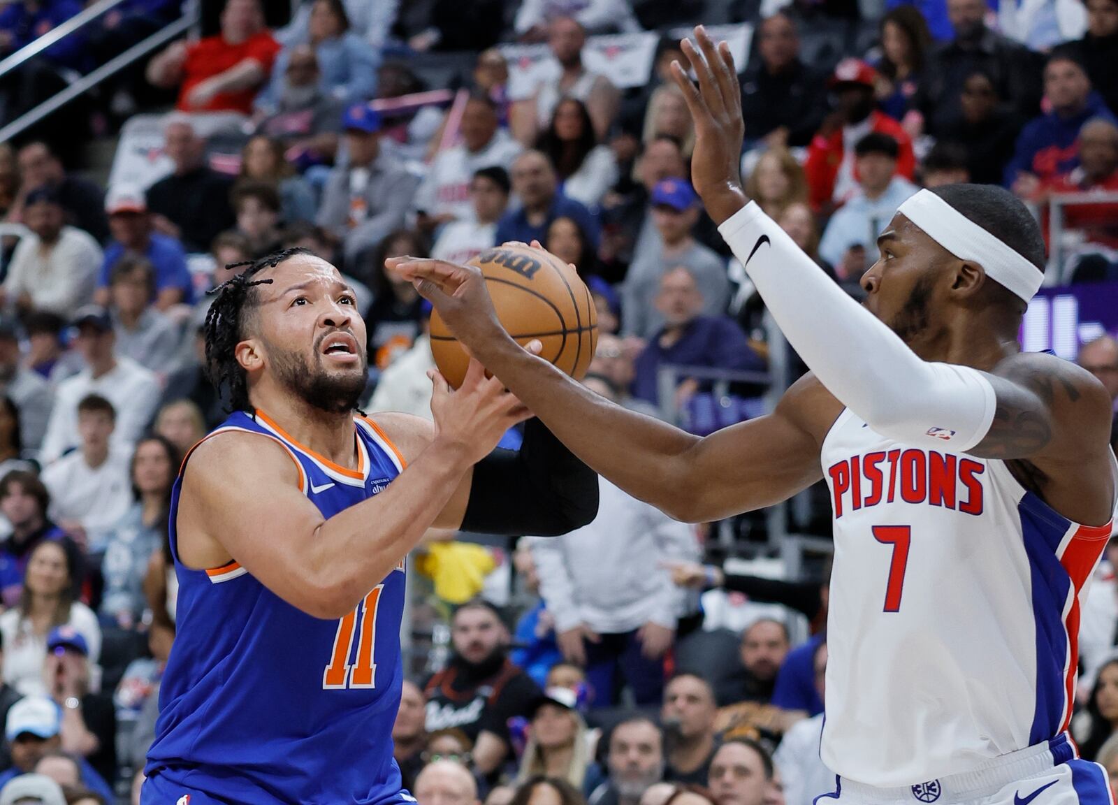 New York Knicks guard Jalen Brunson (11) takes a shot against Detroit Pistons forward Paul Reed during the first half of Game 4 of an NBA basketball first-round playoff series Sunday, April 27, 2025, in Detroit. (AP Photo/Duane Burleson)