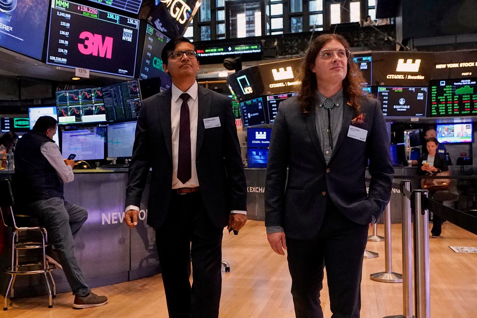 XPRIZE Carbon Removal winners from Mati Carbon, Founder & CEO Shantanu Agarwal, left, and Chief Science Officer Jake Jordan, visit the trading floor of the New York Stock Exchange, Tuesday, April 22, 2025. (AP Photo/Richard Drew)