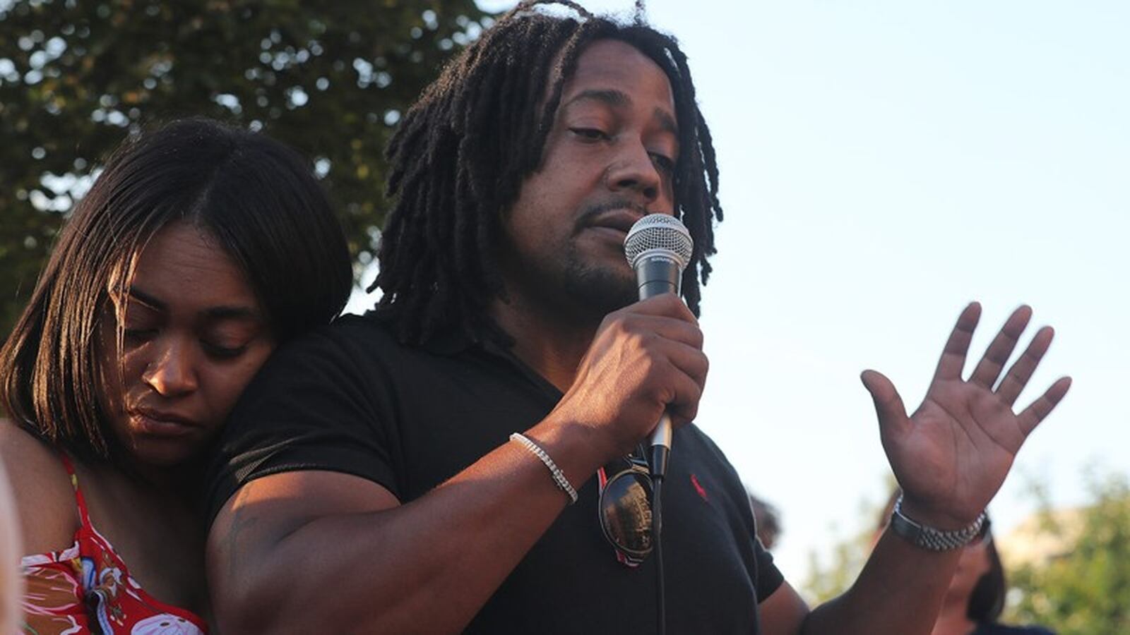 Dion Green, the son of Derrick Fudge, speaks during a candlelight vigil in downtown Springfield in the days following the Dayton mass shooting that claimed the life of his father. BILL LACKEY/STAFF