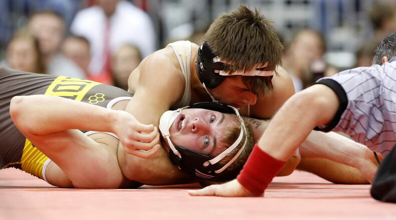 Kaleb Romero of Mechanicsburg wrestles Josh Doherty of West Jefferson at 160 lbs. in Division III during the 79th annual OHSAA state wrestling tournament at the Jerome Schottenstein Center in Columbus on Saturday, March 5, 2016. (Barbara J. Perenic/The Columbus Dispatch)