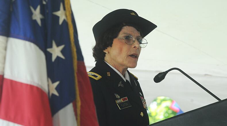 Kathy Platoni, Psy.D., retired U.S. army colonel, gives Memorial Day address at the Dayton National Cemetery Memorial Day ceremony, Monday, May 30, 2016.