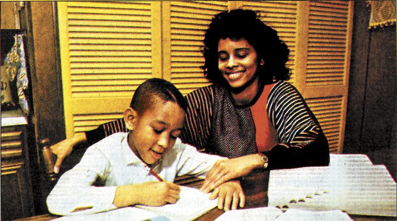 John Stephens, winner of the 1989 District Spelling Bee, is tutored at home by his mother Phyllis.