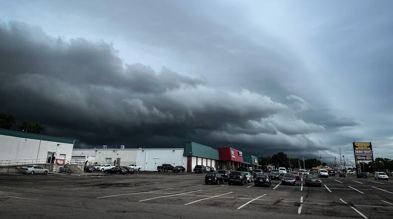 Storm clouds gather over Needmore Road Tuesday, July 5, 2022.