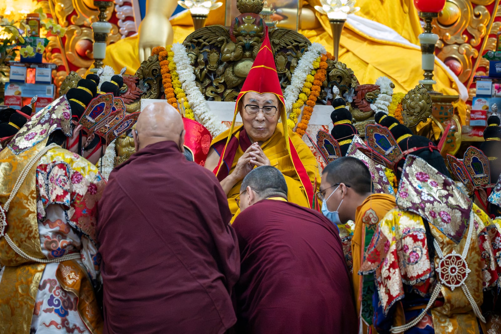 Tibetan spiritual leader the Dalai Lama wears a ceremonial hat as he presides over an event during which Tibetan exiles prayed for his longevity, a day before his 90th birthday, in Dharamshala, India, Saturday, July 5, 2025.(AP Photo/Ashwini Bhatia)