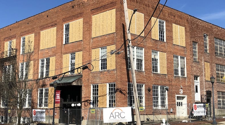 Stryker Construction and ARC, the Alexander family’s recruiting company, have signs up in front of the old shoe factory in Lebanon. STAFF/LAWRENCE BUDD