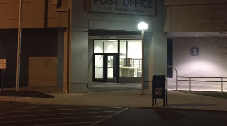 Dayton police are investigating a report that a letter carrier was robbed at gunpoint by two juveniles at this post office late Thursday afternoon, Jan. 19, 2017. (Jarod Thrush/Staff)