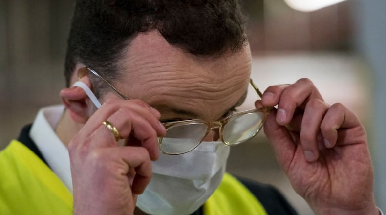 FILE PHOTO: German Federal Health Minister Jens Spahn's glasses start to steam up as he wears a protective mask.. Many people are having the same issue as Spahn. So how can you keep your glasses from fogging while wearing a mask?