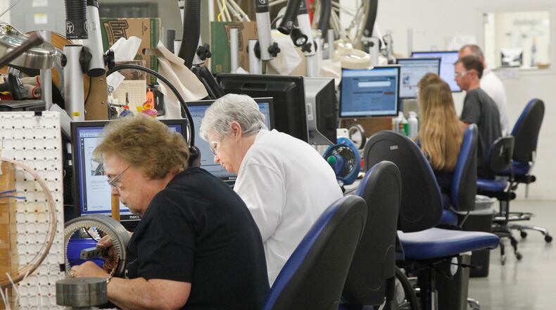 Workers at GE Aviation in Vandalia assemble coils for electrical generation equipment for military aircraft. STAFF PHOTO BY CHRIS STEWART