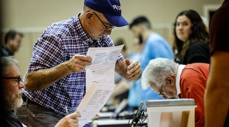 Poll workers at Sinclair College South on Clyo Road  in Centerville were busy with voters Tuesday afternoon. Jim Noelker/Staff