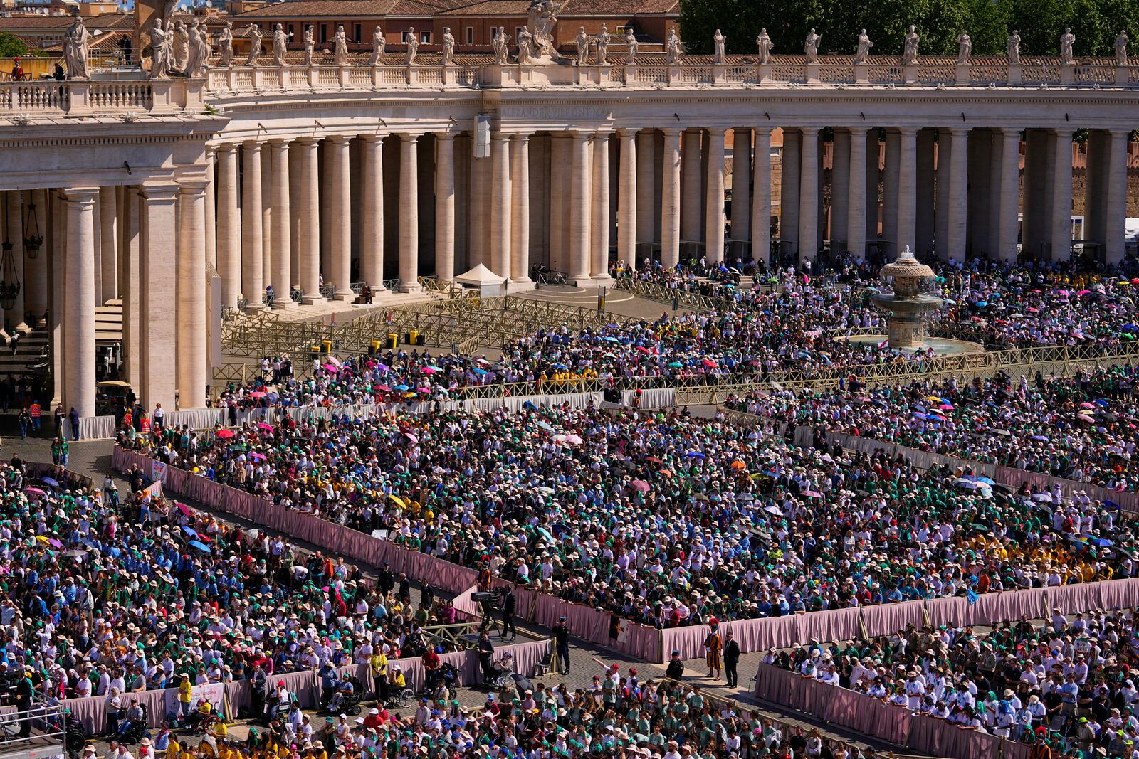People attend a mass presided over by Vatican Secretary of State, Cardinal Pietro Parolin on the second of nine days of mourning for late Pope Francis in St. Peter's Square, at the Vatican, Sunday, April 27, 2025. (AP Photo/Andreea Alexandru)