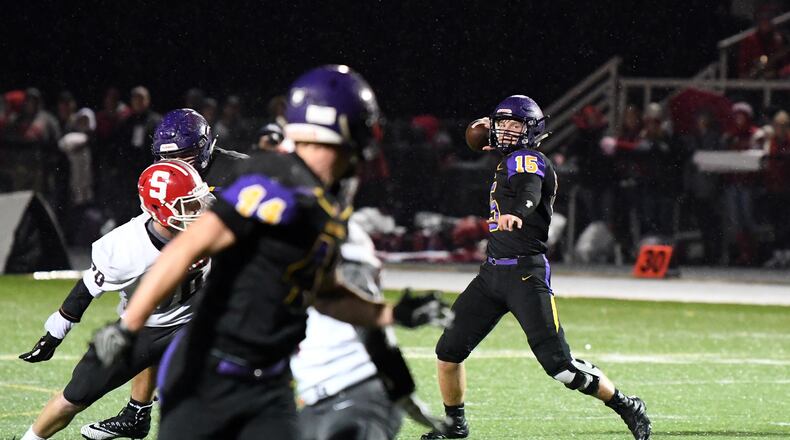 Bellbrook quarterback Brendan Labensky looks to throw a pass during Friday night’s Division III, Region 11 playoff game vs. Thornville Sheridan. Nick Falzerano/CONTRIBUTED