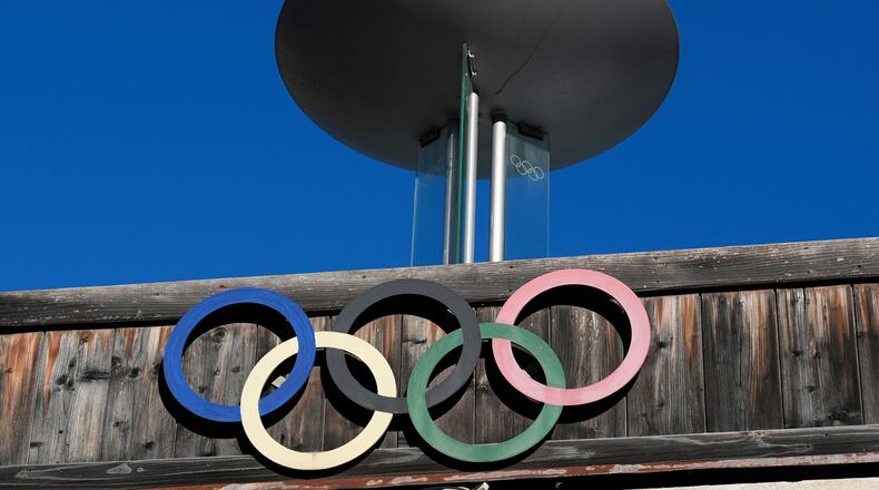FILE - The Olympic rings adorn the Stadio Olimpico del Ghiaccio, which will be called Cortina Curling Olympic Stadium, venue for the curling discipline at the Milan Cortina 2026 Winter Olympics, in Cortina d'Ampezzo, Italy, Thursday, Jan. 16, 2025. (AP Photo/Giovanni Auletta, File)