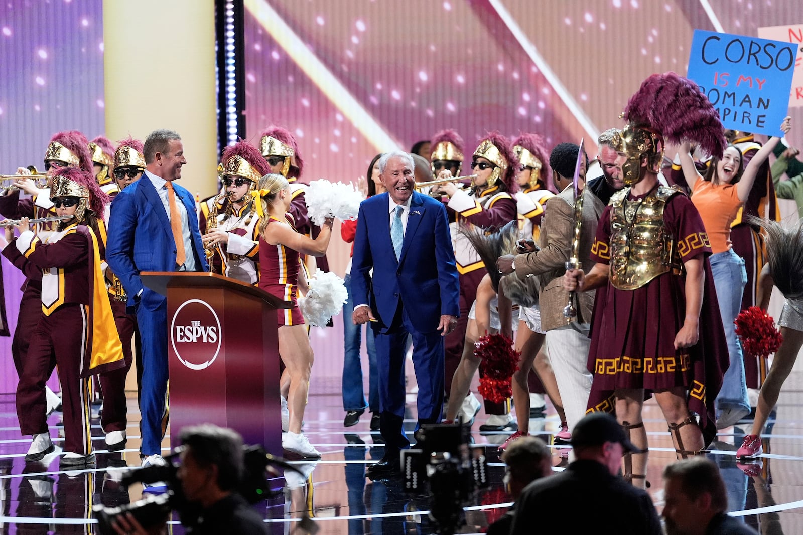 The Southern California band and cheerleaders perform as Lee Corso, middle, is honored on stage at the ESPY Awards at the Dolby Theatre in Los Angeles, Wednesday, July 16, 2025. (AP Photo/Mark J. Terrill)