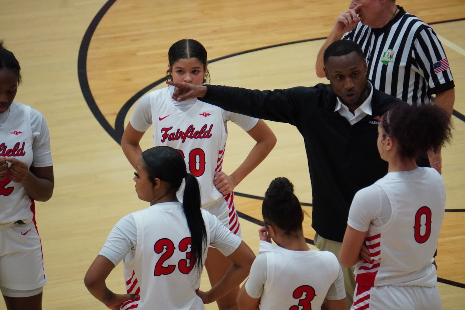 Fairfield coach Jerome Nelson talks to his players during a timeout against Lakota West on Wednesday night. CHRIS VOGT / CONTRIBUTED