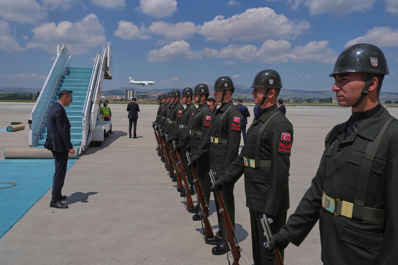 Ukrainian official plane, background, with Ukrainian President Volodymyr Zelenskyy on board lands at Esenboga airport in Ankara, Turkey, Thursday, May 15, 2025. (AP Photo/Evgeniy Maloletka)