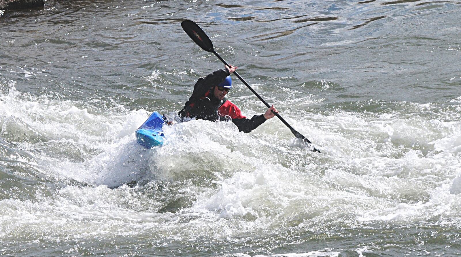 The Great Miami Riverway passes Riverscape in downtown Dayton. Here a man takes advantage of the RiverScape river run area with his kayak Thursday, Oct. 13, 2016. MARSHALL GORBY / STAFF