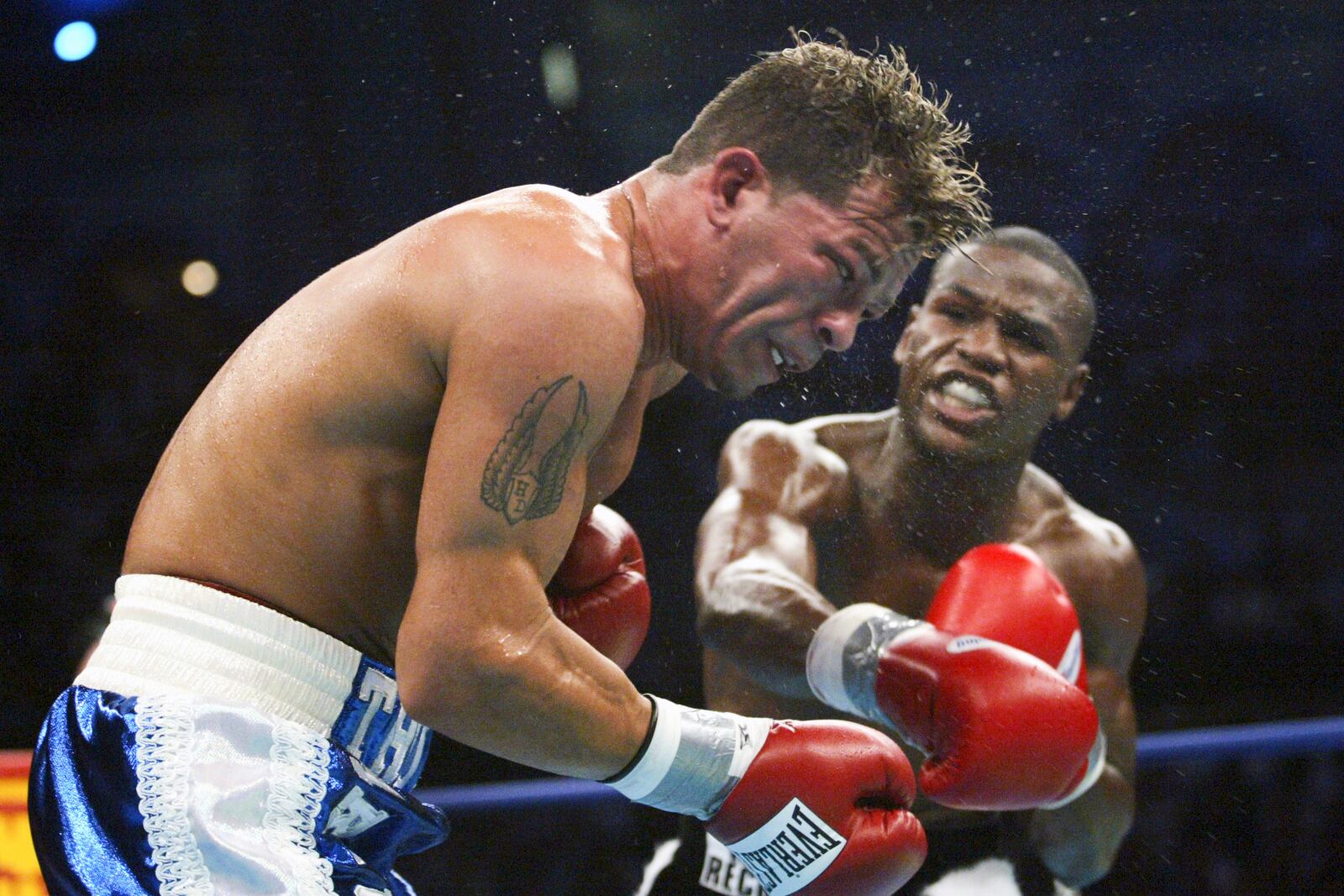 FILE - Floyd Mayweather Jr., right, of Las Vegas, Nev., hits Arturo Gatti of Jersey City, N. J., during the second round of their WBO World Super Lightweight title bout at Atlantic City's Boardwalk Hall Saturday, June 25, 2005 in Atlantic City, N.J.. (AP Photo/Mel Evans, File)