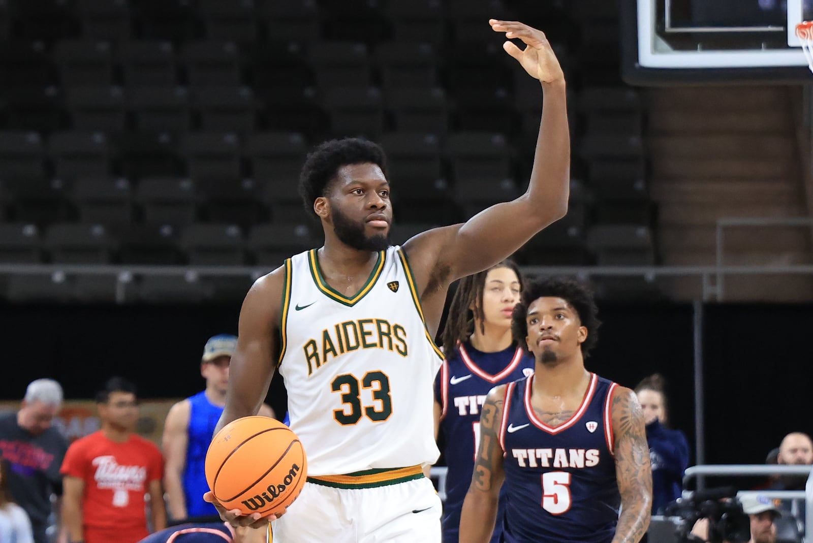 Wright State University's Michael Imariagbe motions to the crowd in celebration in the waning moments of their 66-63 victory over Detroit Mercy in the Horizon League tournament final on Tuesday, March 10, 2026 at Corteva Coliseum in Indianapolis. HORIZON LEAGUE / CONTRIBUTED PHOTO