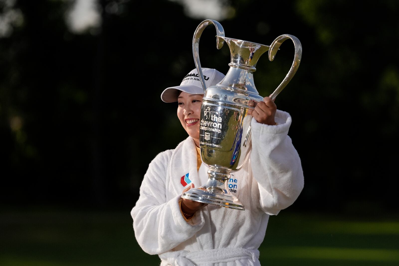 Mao Saigo, of Japan, holds the trophy after winning the Chevron Championship LPGA golf tournament Sunday, April 27, 2025, in The Woodlands, Texas. (AP Photo/Ashley Landis)