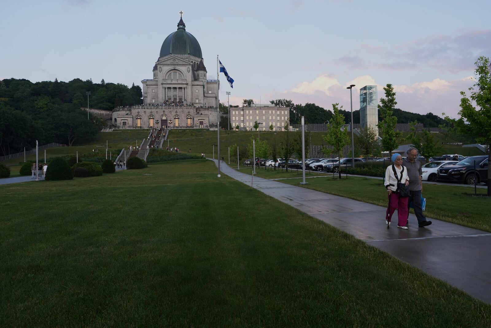 Visitors leave the national shrine of Saint Joseph's Oratory of Mount Royal in Montreal, Saturday, June 28, 2025. (AP Photo/Luis Andres Henao)