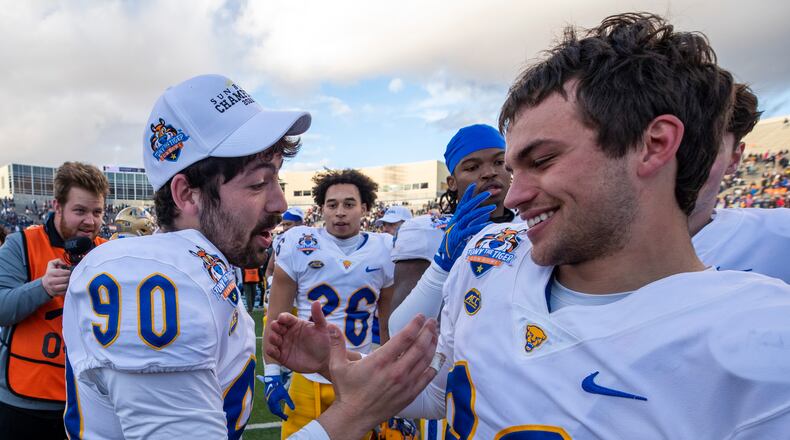 Pittsburgh place-kicker Ben Sauls (90) and punter Cam Guess (92) celebrate after the team's win over UCLA in the Sun Bowl NCAA college football game Friday, Dec. 30, 2022, in El Paso, Texas. (AP Photo/Andres Leighton)