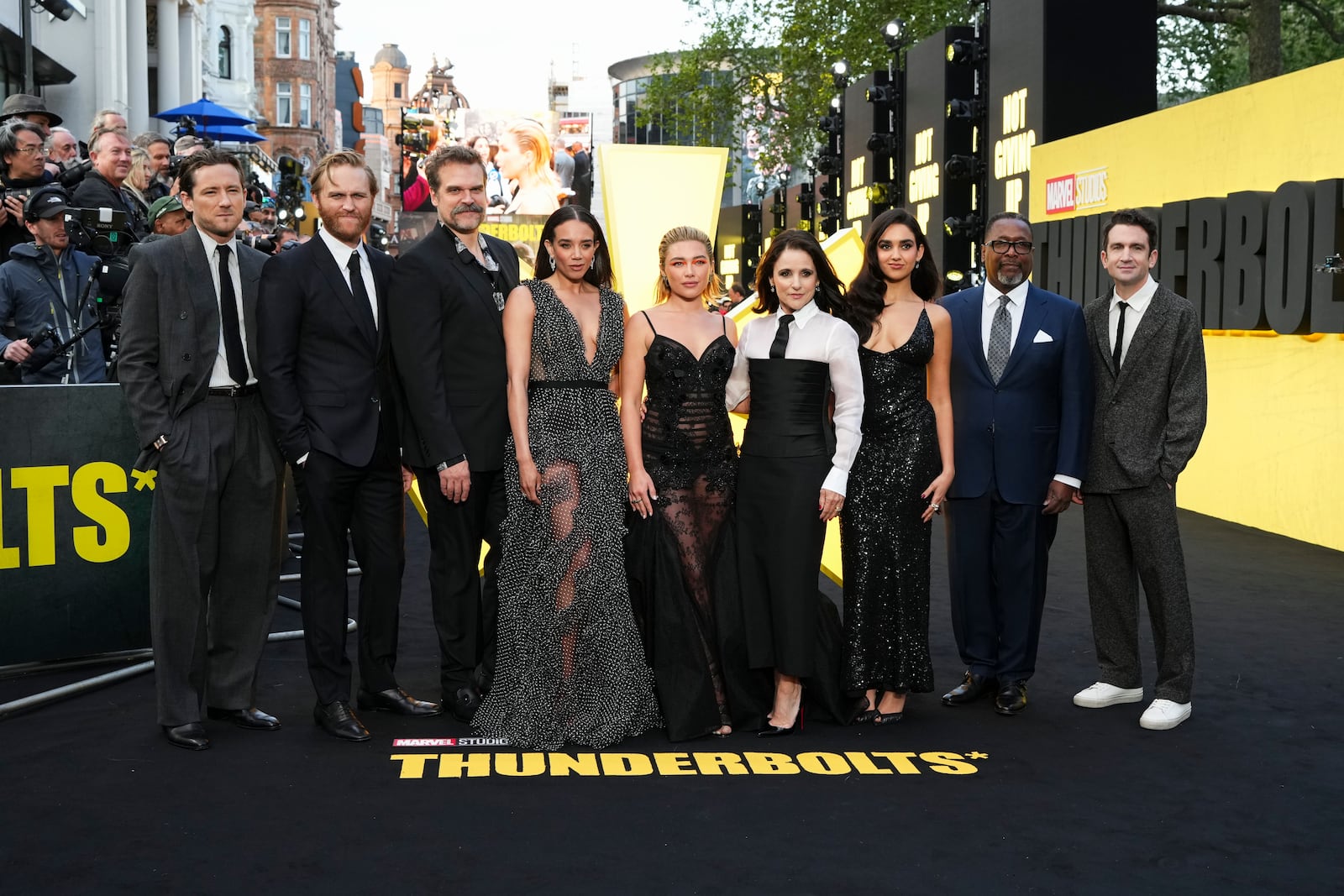 Lewis Pullman, from left, Wyatt Russell, David Harbour, Hannah John-Kamen, Florence Pugh, Julia Louis-Dreyfus, Geraldine Viswanathan, Wendell Pierce, and Jake Schreier pose for photographers upon arrival at a screening of the film 'Thunderbolts' on Tuesday, April 22, 2025, in London. (Photo by Scott A Garfitt/Invision/AP)