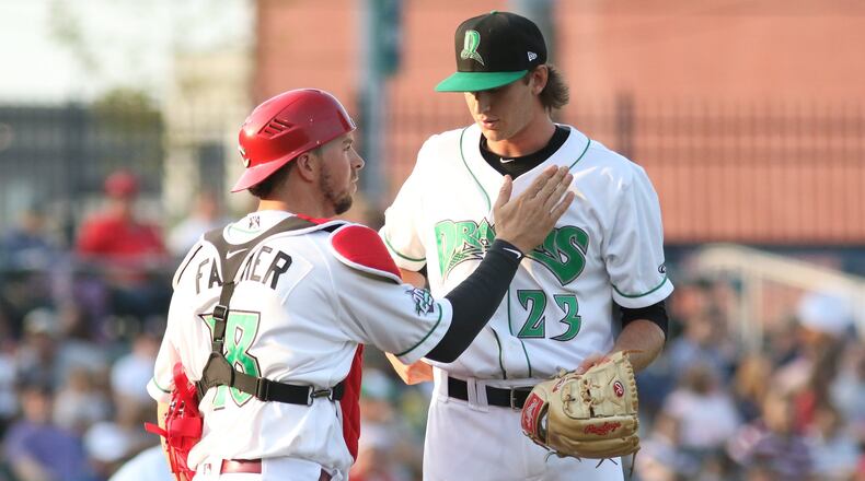 Dayton Dragons shortstop Miguel Hernandez fields a throw from right fielder Brian Rey as Great Lakes’ Dan Robinson slides into second base during their game on Friday night at Fifth Third Field. Robinson was out on the play, but the Loons beat the Dragons 1-0 in 10 innings. CONTRIBUTED PHOTO BY MICHAEL COOPER
