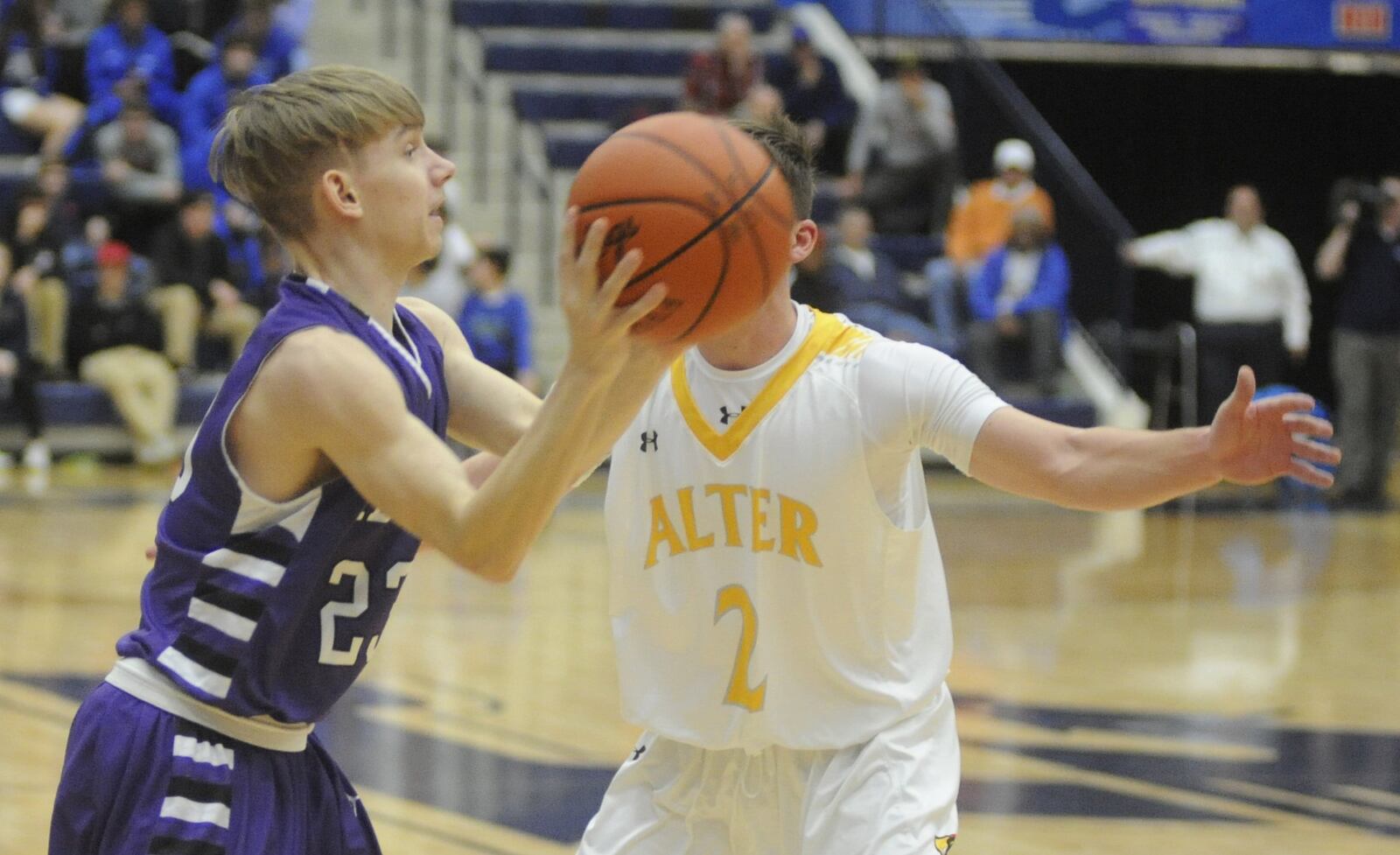 Middletown’s Colin Isaacs (with ball) is checked by Alter’s Robby Ruffolo during Monday night’s game in the Premier Health Flyin’ to the Hoop at Fairmont’s Trent Arena. MARC PENDLETON/STAFF