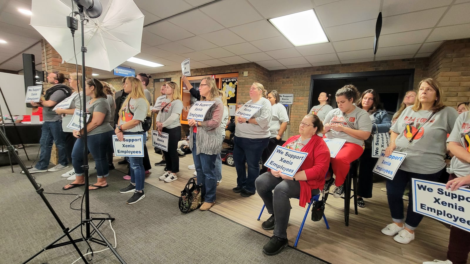 At a standing-room-only meeting of the Xenia Board of Education Monday, many in attendance held signs in support of Xenia teachers and educators, October 13, 2025. LONDON BISHOP/STAFF