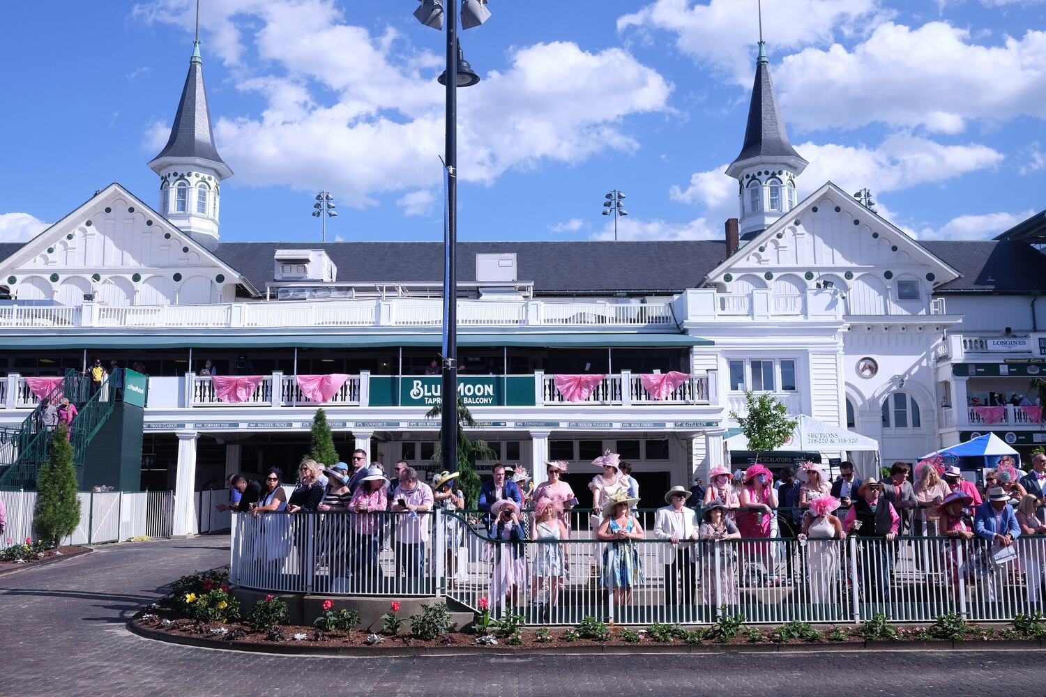 People gather at Churchill Downs in Louisville, Ky., for the Kentucky Oaks race on Friday, April 30, 2021, where capacity is limited in the wake of the coronavirus pandemic. (Christian Hansen/The New York Times)