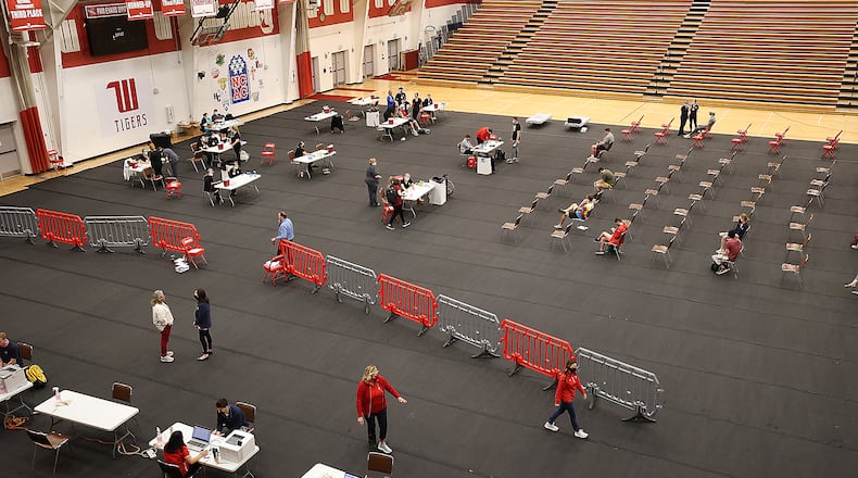 A COVID vaccination clinic is set up in the Pam Evans Smith Arena on the Wittenberg University campus. BILL LACKEY/STAFF