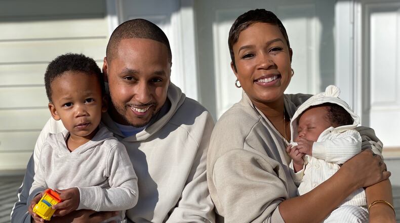 Quincy Heflin hold his son Ian and his wife, Dara, holds their daughter Ellie. CONTRIBUTED