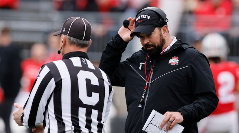 FILE — Ohio State head coach Ryan Day, right, talks with a referee during an NCAA college spring football game in this April 16, 2022 file photo, in Columbus, Ohio. The pain of Ohio State's loss to Michigan last season remains for the Buckeyes, who can't wait to try to avenge the loss. (AP Photo/Jay LaPrete, File)