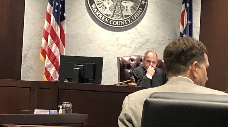 Lawyer Martin Hubbell discusses the case of the 12-year-old Springboro student charged in connection with a school dance lockdown with Judge Joe Kirby. STAFF/LAWRENCE BUDD