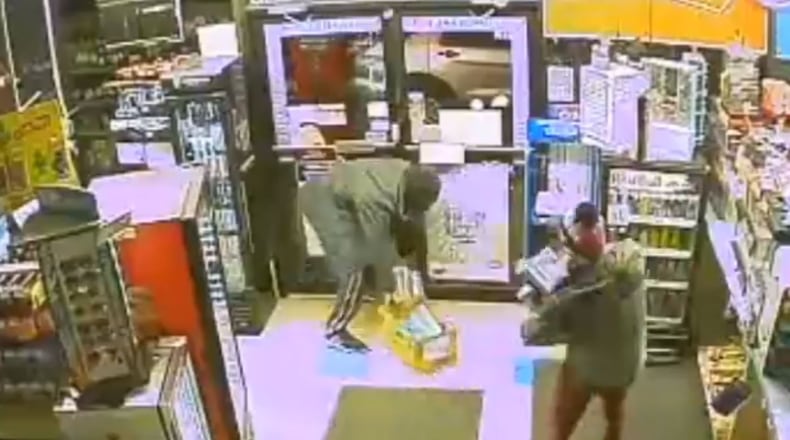 On Feb. 11, a couple steals cartons of cigarettes from convenience store in the city of Fairfield. CONTRIBUTED